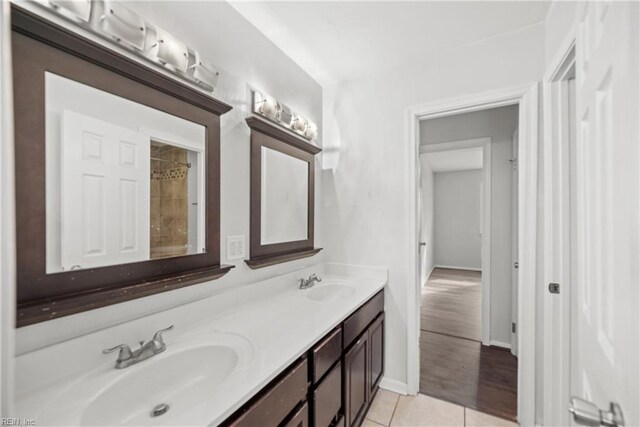 5607 Dodington Ct, Virginia Beach, VA 23462 - full bathroom with double vanity, baseboards, and tile patterned flooring