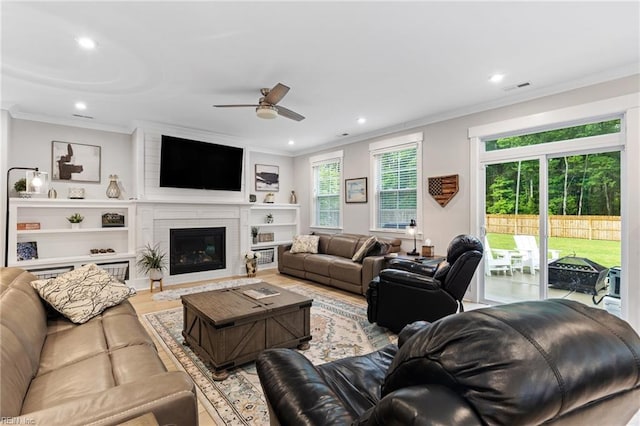 2349 Treesong Trl, Virginia Beach, VA 23456 - living area with ornamental molding, a ceiling fan, recessed lighting, a brick fireplace, and wood finished floors