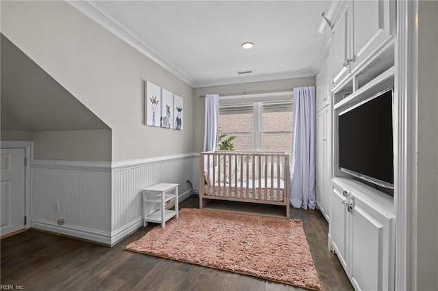 2509 Lone Pine Pt, Virginia Beach, VA 23451 - bedroom with dark wood-style floors, a wainscoted wall, ornamental molding, and a nursery area