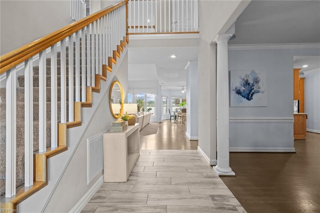 2509 Lone Pine Pt, Virginia Beach, VA 23451 - foyer entrance featuring ornate columns, ornamental molding, stairs, baseboards, and wood finished floors