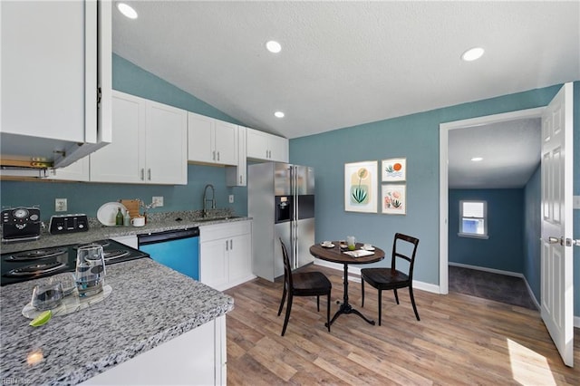 kitchen with dishwasher, stainless steel refrigerator with ice dispenser, light stone countertops, white cabinetry, and light wood-style flooring