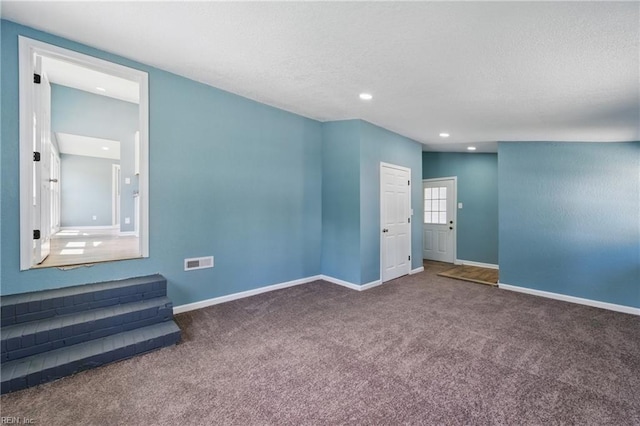 unfurnished room featuring carpet flooring, baseboards, recessed lighting, and a textured ceiling