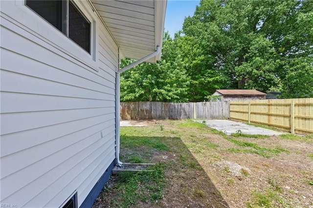 fenced backyard with a patio