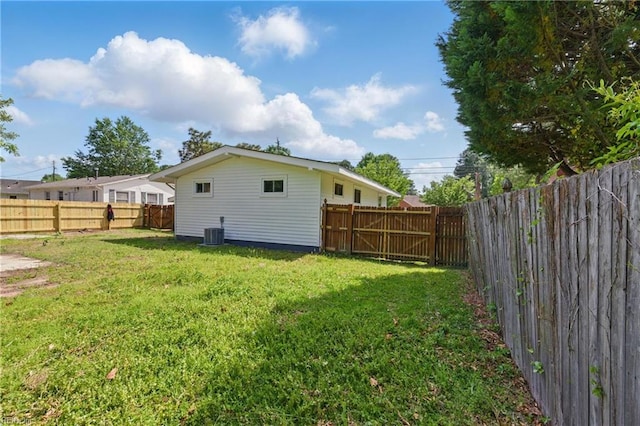 rear view of property featuring central AC