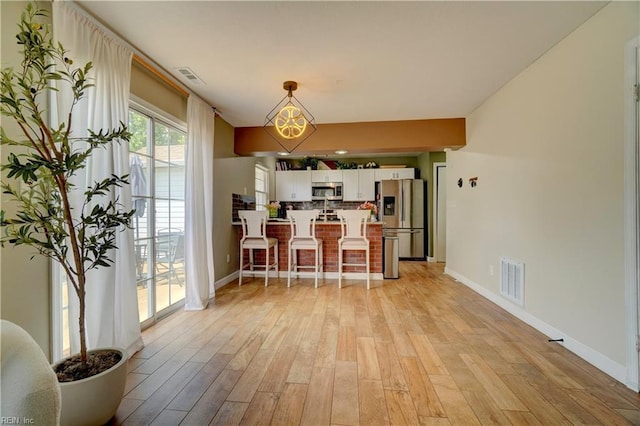 100 Castilian Dr, Virginia Beach, VA 23462 - dining room featuring baseboards and light wood-type flooring
