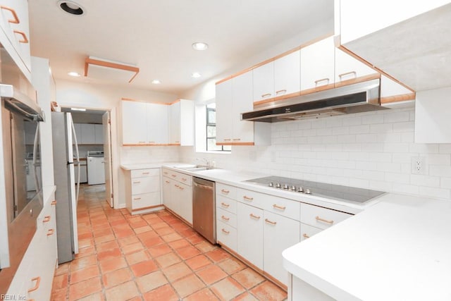 6025 River Rd, Norfolk, VA 23505 - kitchen with under cabinet range hood, stainless steel dishwasher, black electric stovetop, a sink, and tasteful backsplash