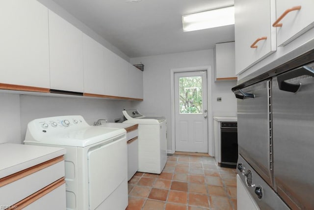 6025 River Rd, Norfolk, VA 23505 - laundry area with washing machine and dryer, cabinet space, and light tile patterned floors