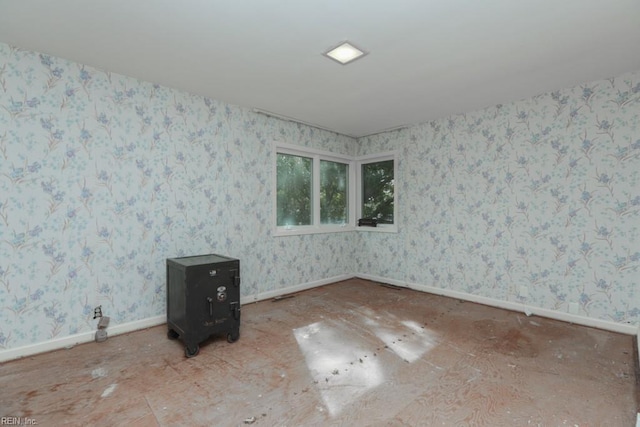 6025 River Rd, Norfolk, VA 23505 - unfurnished room featuring baseboards and wallpapered walls