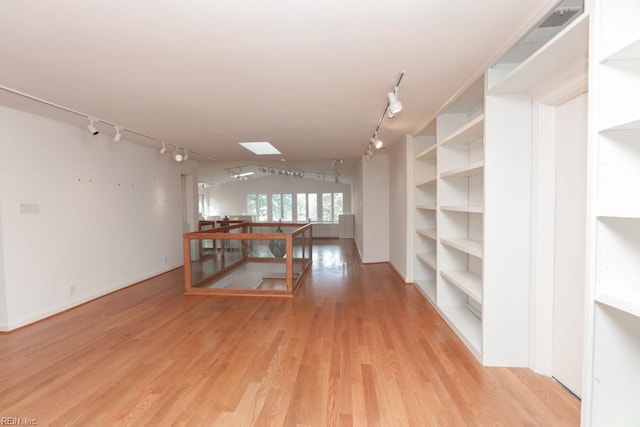 6025 River Rd, Norfolk, VA 23505 - empty room featuring track lighting, light wood-type flooring, and baseboards