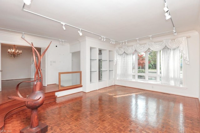 6025 River Rd, Norfolk, VA 23505 - spare room featuring track lighting, a chandelier, built in features, and baseboards