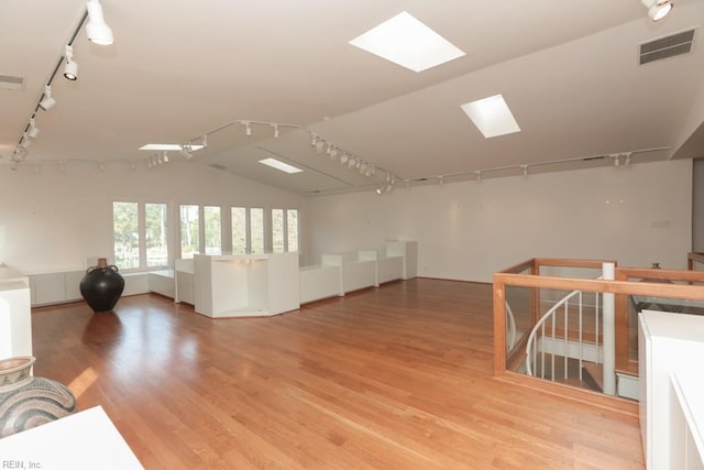 6025 River Rd, Norfolk, VA 23505 - unfurnished room with rail lighting, a skylight, light wood-type flooring, and lofted ceiling