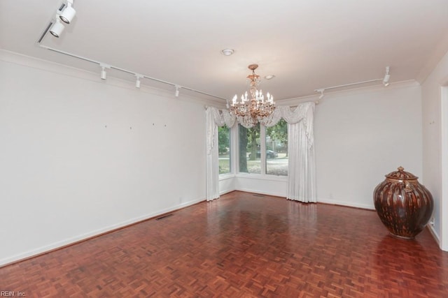 6025 River Rd, Norfolk, VA 23505 - spare room with track lighting, a chandelier, and baseboards