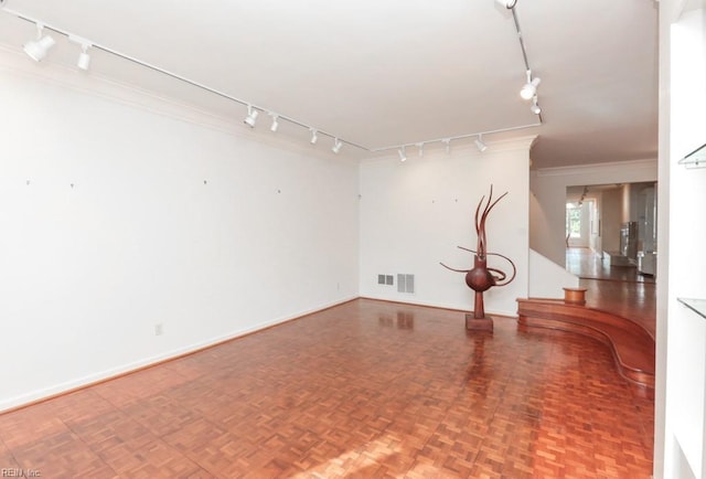 6025 River Rd, Norfolk, VA 23505 - empty room featuring track lighting, ornamental molding, and baseboards