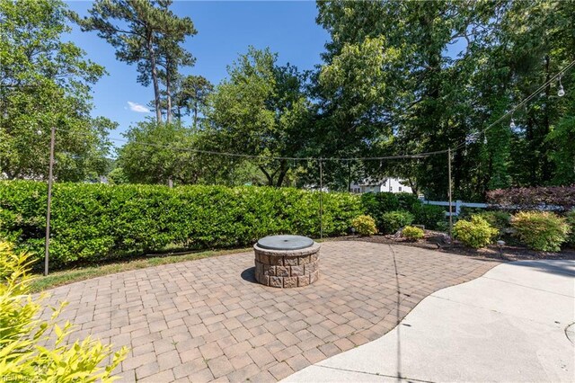 view of patio / terrace featuring a fire pit