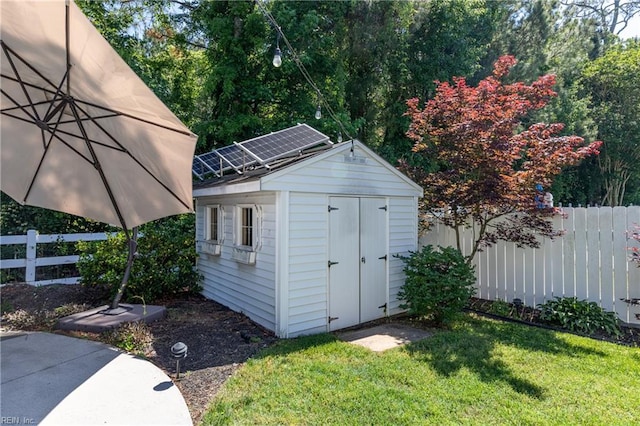 view of shed with solar panels