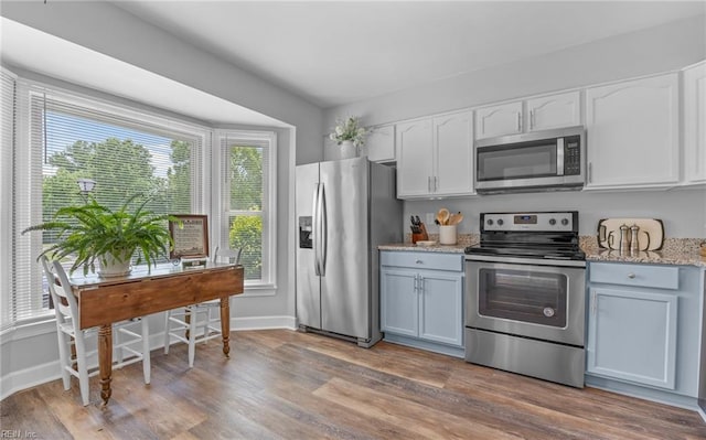 8 Riverview Ct, Suffolk, VA 23434 - kitchen with stainless steel appliances, white cabinets, wood finished floors, and baseboards