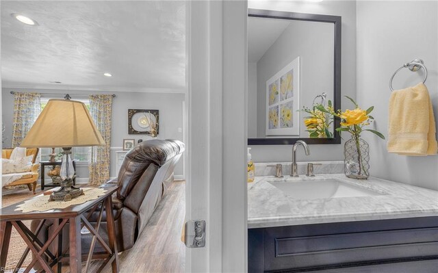 8 Riverview Ct, Suffolk, VA 23434 - bathroom featuring wood finished floors, crown molding, vanity, and recessed lighting