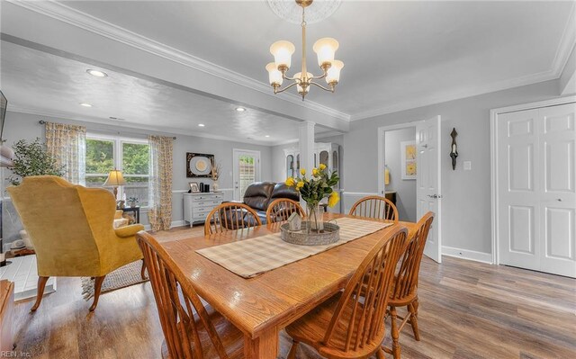8 Riverview Ct, Suffolk, VA 23434 - dining space featuring wood finished floors, recessed lighting, a chandelier, crown molding, and baseboards