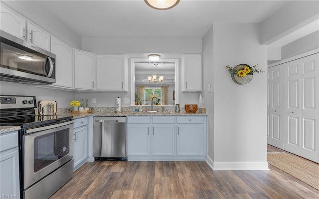 8 Riverview Ct, Suffolk, VA 23434 - kitchen with stainless steel appliances, white cabinets, dark wood-type flooring, and light stone counters