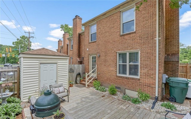 8 Riverview Ct, Suffolk, VA 23434 - rear view of property with a wooden deck, brick siding, fence, an outbuilding, and a storage unit