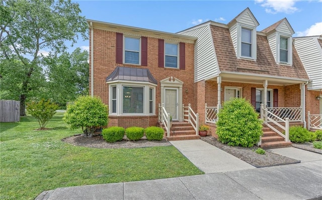 8 Riverview Ct, Suffolk, VA 23434 - view of property with brick siding and a front lawn