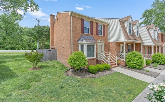 8 Riverview Ct, Suffolk, VA 23434 - view of front of home with brick siding, covered porch, and a chimney