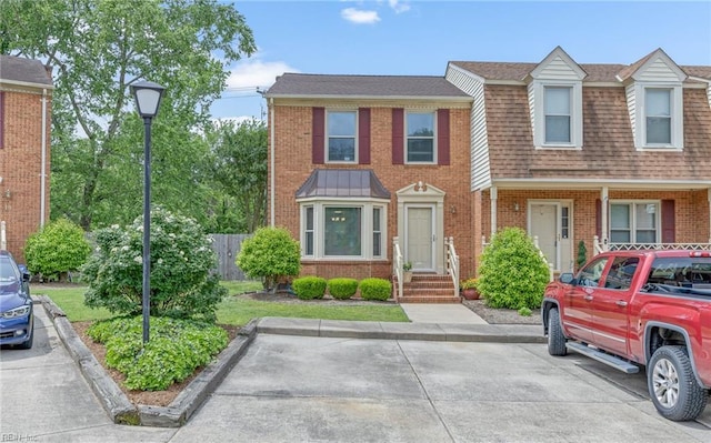8 Riverview Ct, Suffolk, VA 23434 - townhome / multi-family property with brick siding, roof with shingles, and fence