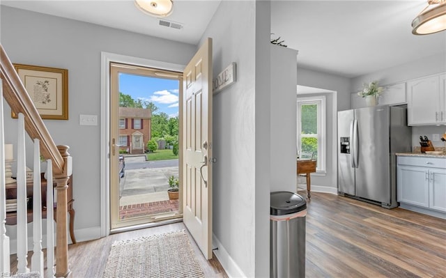 8 Riverview Ct, Suffolk, VA 23434 - foyer entrance with light wood-type flooring, stairway, and baseboards