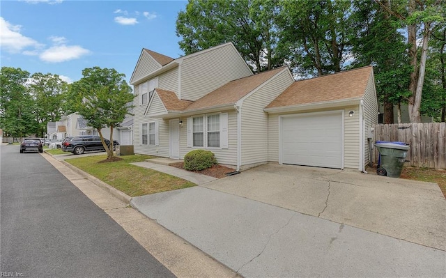 187 N Hunt Club Run, Newport News, VA 23608 - view of front of property with a garage, fence, concrete driveway, and a shingled roof