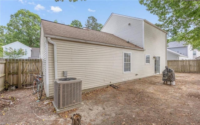 187 N Hunt Club Run, Newport News, VA 23608 - rear view of property featuring cooling unit, a fenced backyard, and roof with shingles