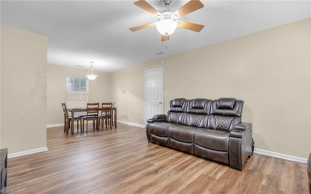 187 N Hunt Club Run, Newport News, VA 23608 - living room with wood finished floors, ceiling fan, and baseboards