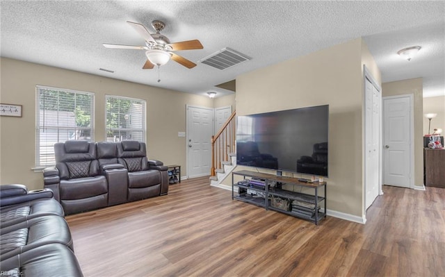 187 N Hunt Club Run, Newport News, VA 23608 - living room with a ceiling fan, wood finished floors, stairway, a textured ceiling, and baseboards