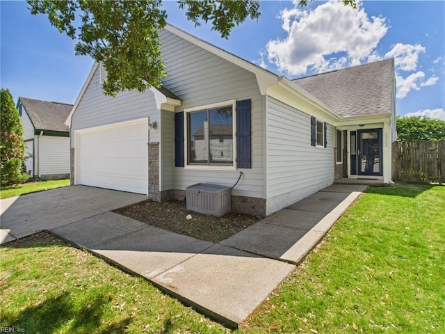 ranch-style house featuring an attached garage, concrete driveway, and roof with shingles