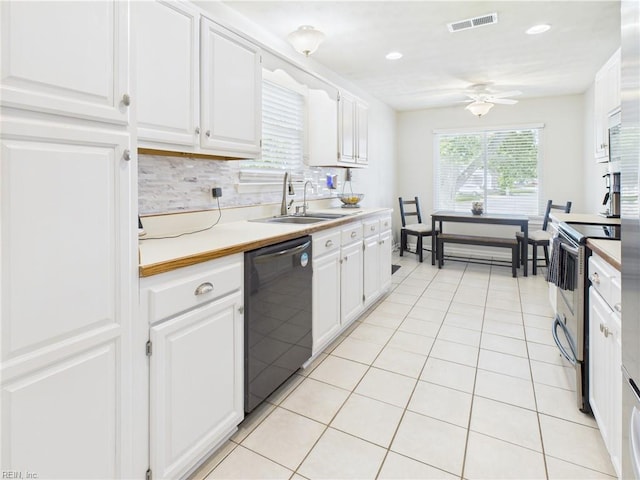 kitchen featuring dishwasher, electric stove, a sink, ceiling fan, and white cabinetry