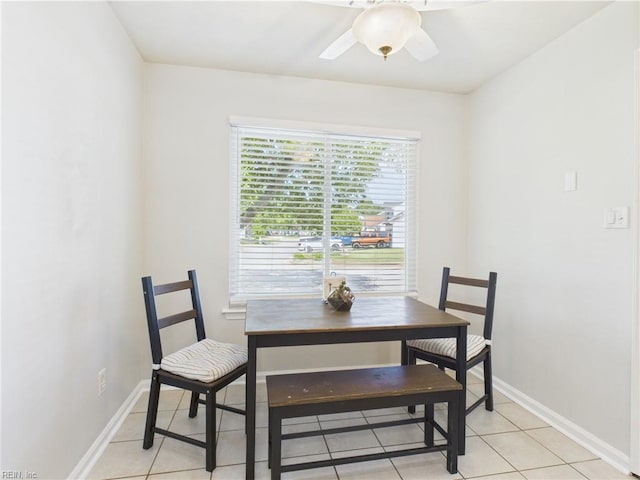 dining room with light tile patterned floors, ceiling fan, and baseboards