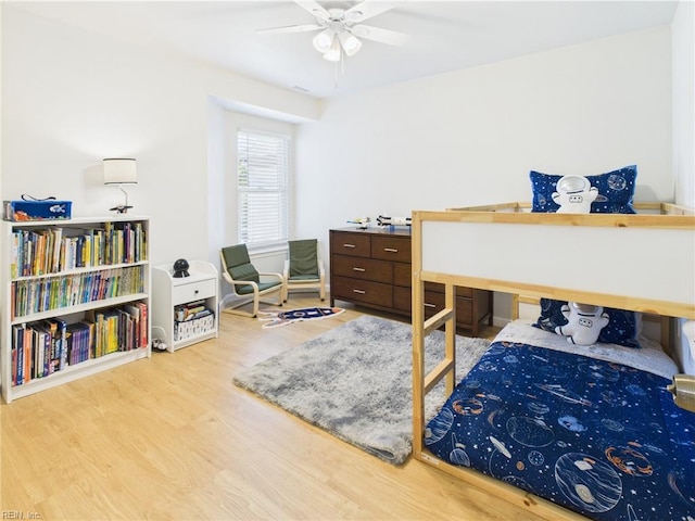 bedroom featuring wood finished floors and ceiling fan