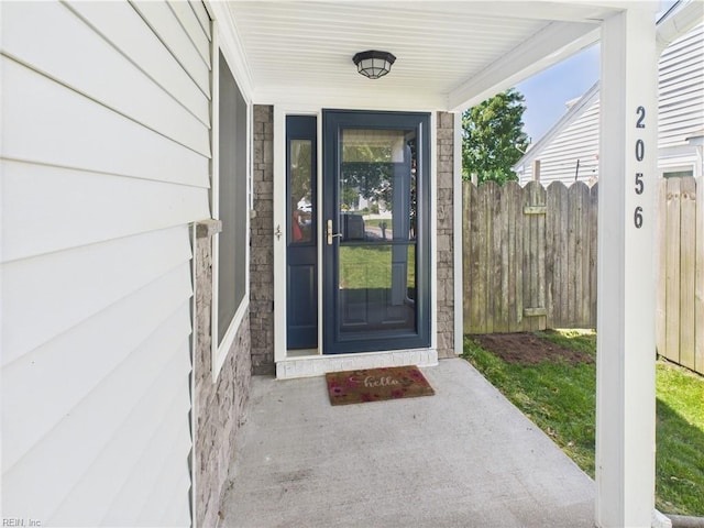 doorway to property with fence