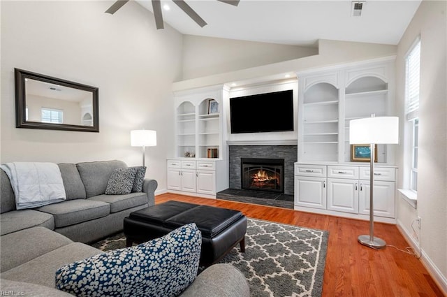 816 Dawson Cir, Chesapeake, VA 23322 - living room with vaulted ceiling, ceiling fan, wood finished floors, a fireplace, and baseboards