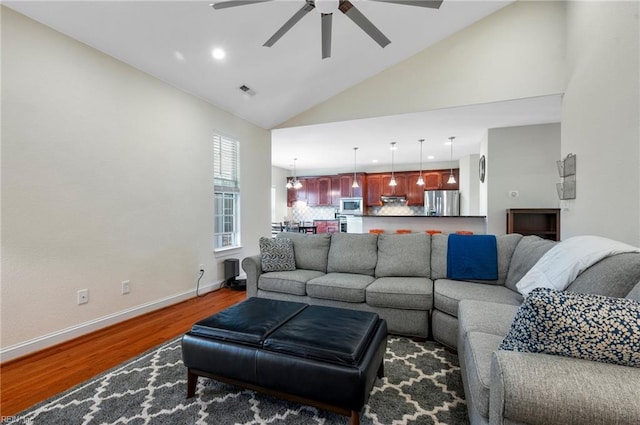 816 Dawson Cir, Chesapeake, VA 23322 - living area featuring dark wood finished floors, a ceiling fan, baseboards, high vaulted ceiling, and recessed lighting