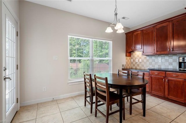 816 Dawson Cir, Chesapeake, VA 23322 - dining space with light tile patterned floors, a chandelier, and baseboards
