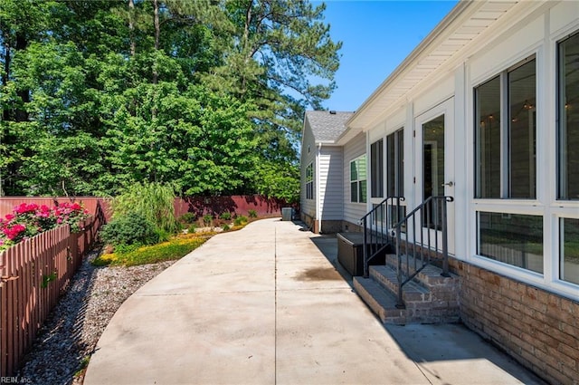 816 Dawson Cir, Chesapeake, VA 23322 - view of patio / terrace with entry steps, a fenced backyard, and driveway