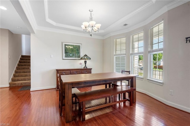 816 Dawson Cir, Chesapeake, VA 23322 - dining area featuring a raised ceiling, hardwood / wood-style flooring, a chandelier, stairway, and crown molding