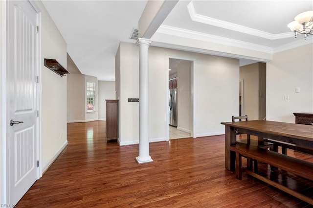 816 Dawson Cir, Chesapeake, VA 23322 - dining space featuring wood finished floors, a chandelier, crown molding, baseboards, and ornate columns