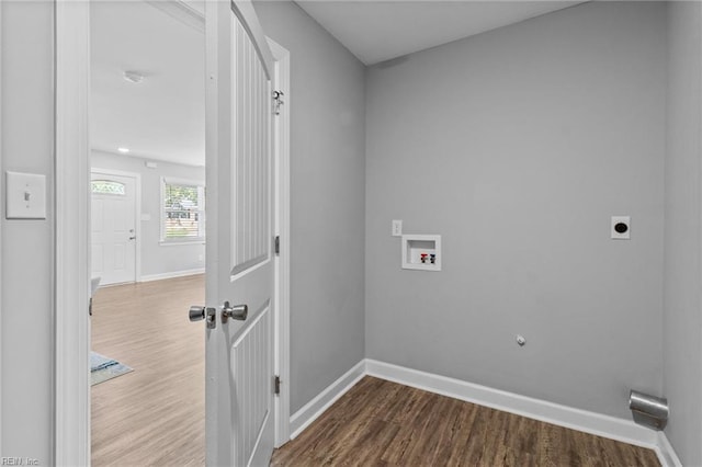 laundry area featuring hookup for an electric dryer, washer hookup, dark wood-style flooring, and baseboards