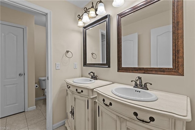 515 Battery Ave, Suffolk, VA 23434 - full bathroom featuring tile patterned flooring, two vanities, toilet, and baseboards