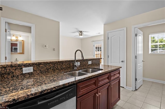 515 Battery Ave, Suffolk, VA 23434 - kitchen with a sink, dishwasher, dark stone countertops, baseboards, and light tile patterned flooring