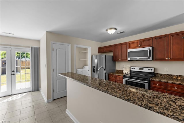 515 Battery Ave, Suffolk, VA 23434 - kitchen featuring stainless steel appliances, washer and dryer, french doors, baseboards, and dark brown cabinets