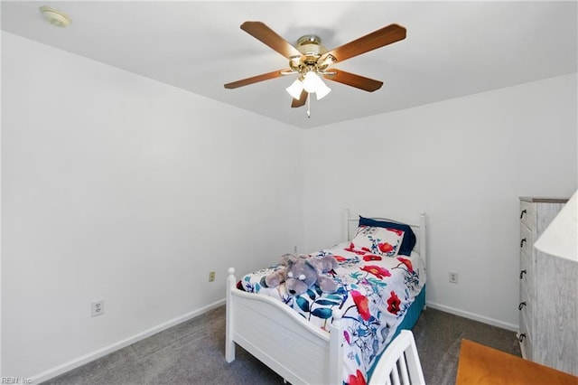 carpeted bedroom with baseboards and a ceiling fan