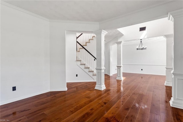 unfurnished living room with stairway, a chandelier, dark wood-style floors, ornamental molding, and baseboards