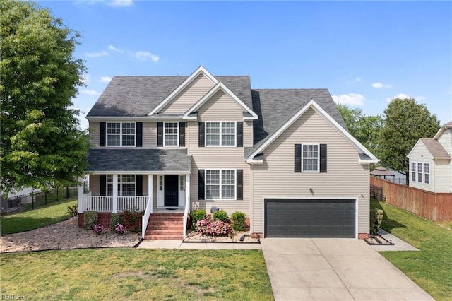 view of front facade with covered porch, an attached garage, driveway, and roof with shingles